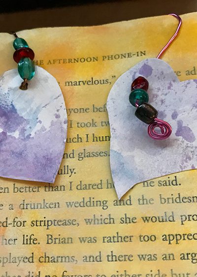 Heart Embellishments Hanging from Junk Journal Page